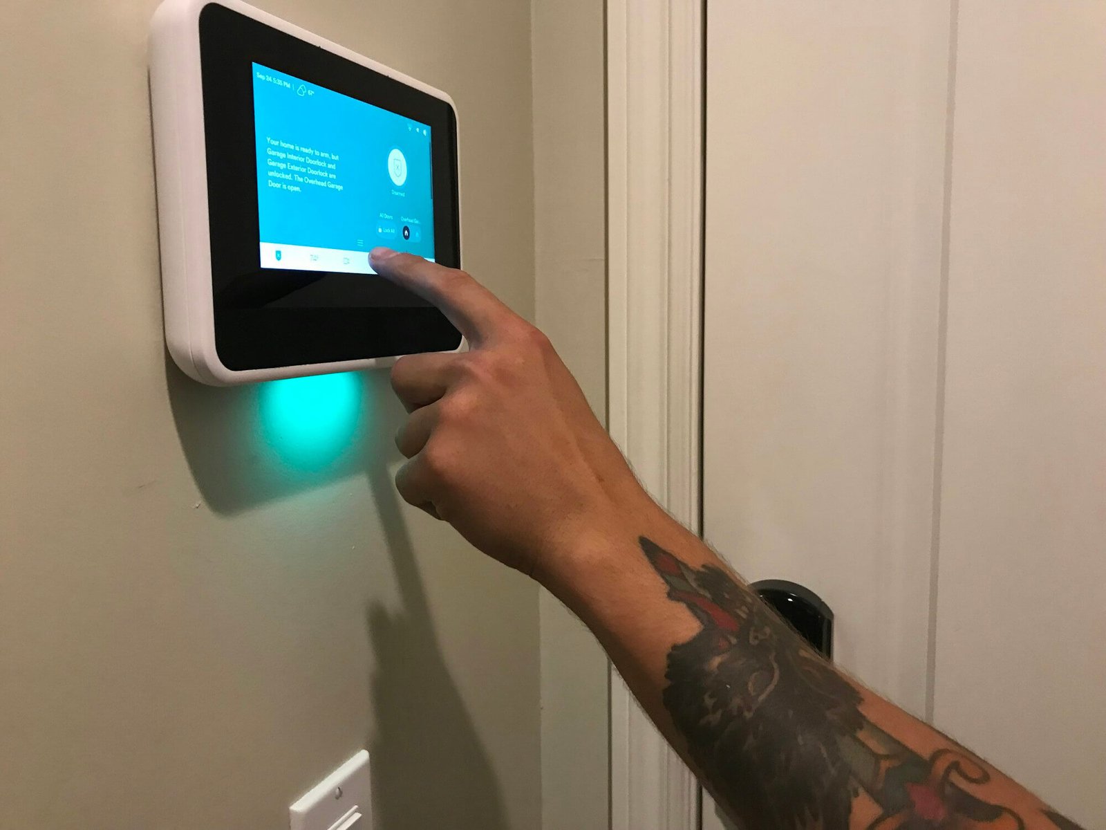 a-technician-gives-instructions-on-programming-the-home-security-panel-in-a-smart-home-.jpg